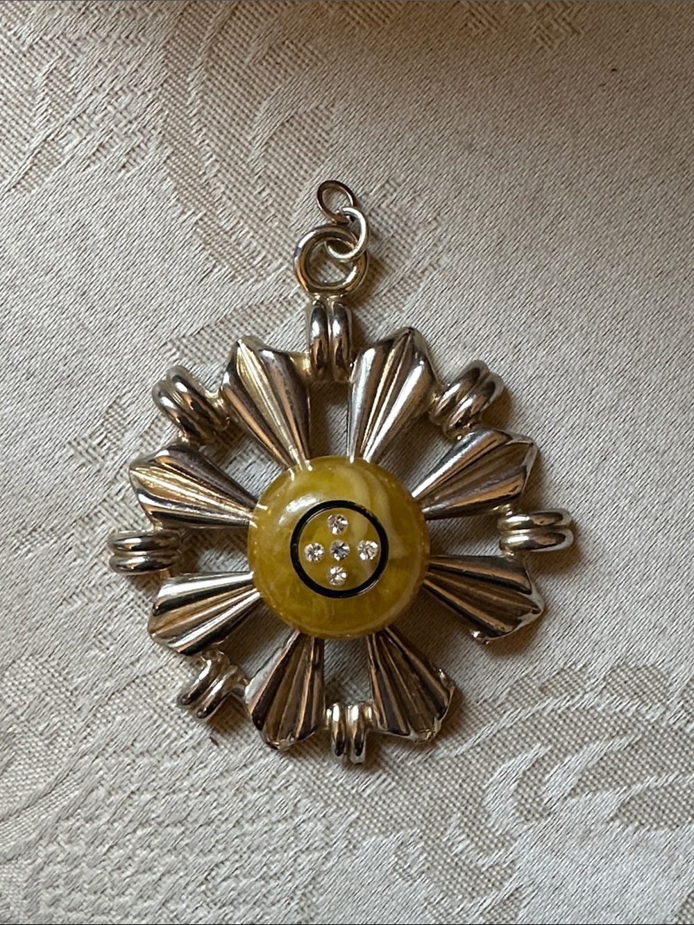 1950s pendant with yellow lucite and rhinestones, missing a petal